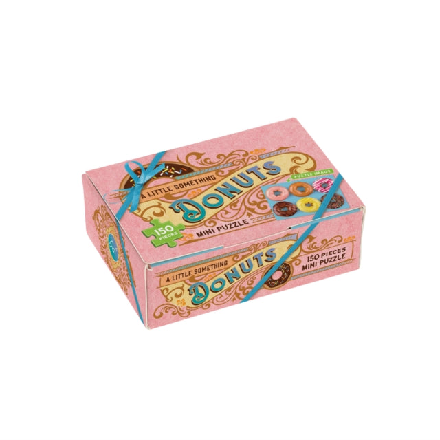 Binding: Toys & Hobbies
Description: Sweet and petite this themed puzzle looks like a box of donuts. A little something to bring delight! This 150 - Piece Mini Puzzle offers a delicious activity for puzzlers.